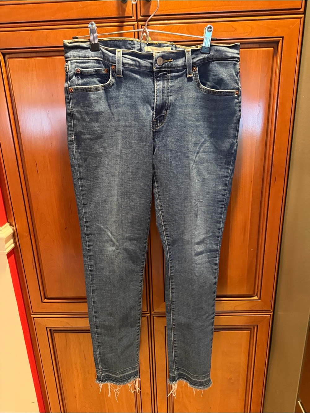 Levi's Women's Boyfriend Jeans in Medium Blue with Frayed Hem